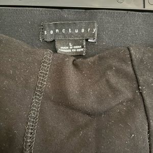 Black skinny trouser with red stripes on both the sides.